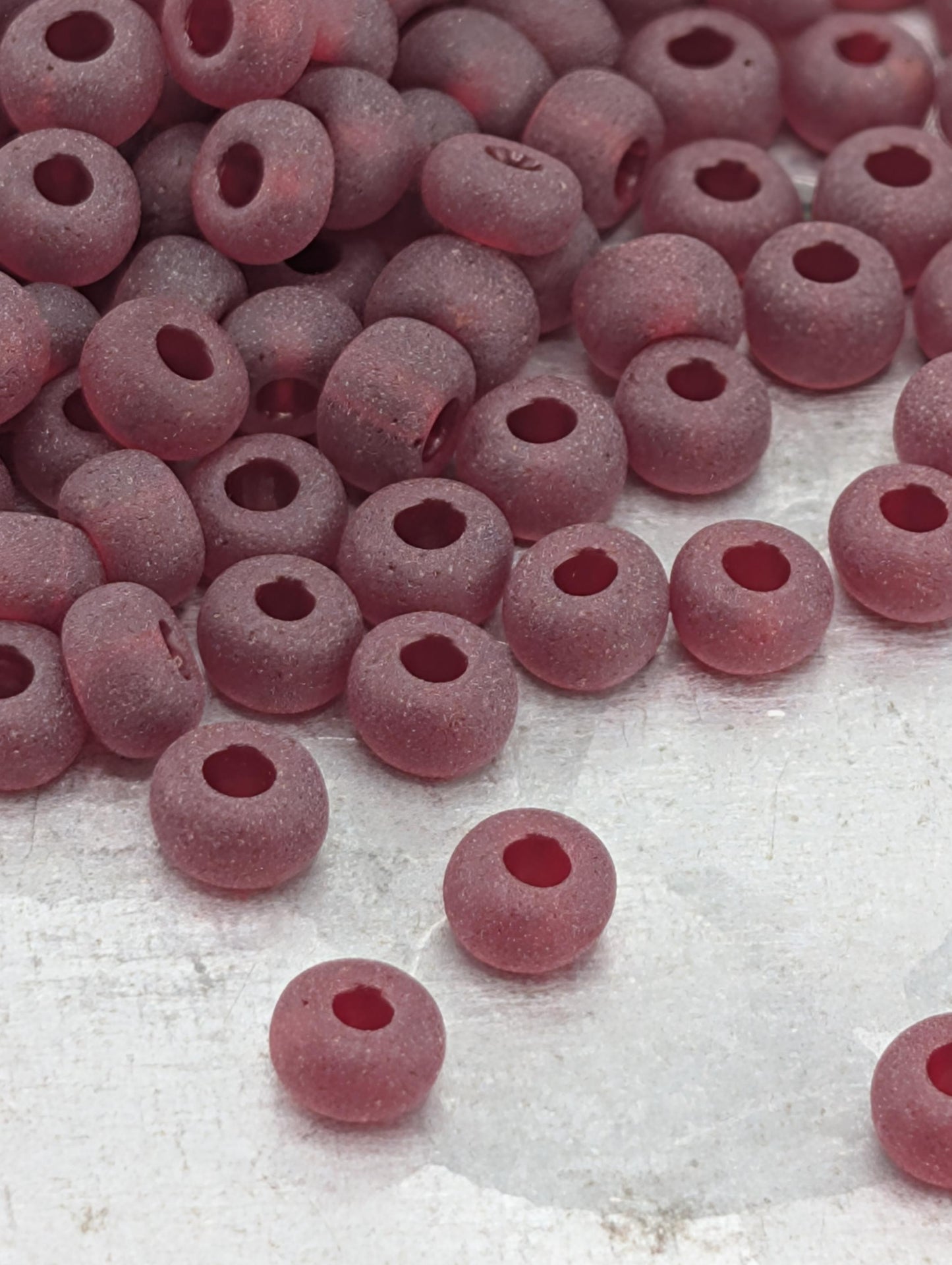 Preciosa 6/0 Round, Transparent Matte Garnet. 15g pkg
