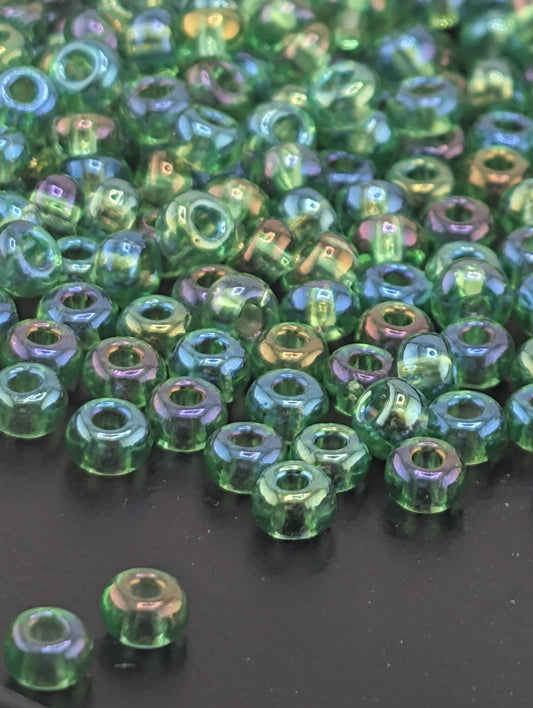 Preciosa 6/0 Round, Translucent Rainbow Light Green. 15g pkg