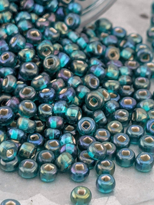 Transparent Silver-Lined Teal Green AB Size 6/0 15g pkg
