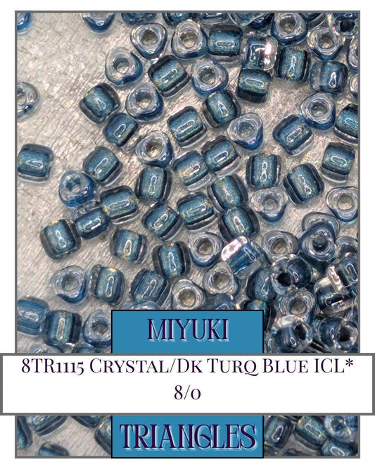 8TR1115-Miyuki Triangle Beads:Crystal/Dk Turq Blue ICL* (10g pkg)