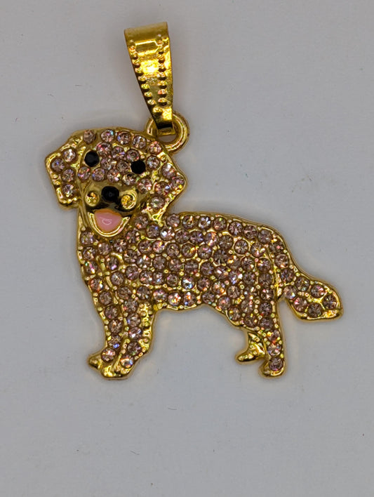A gold-colored pendant in the shape of a dog, adorned with numerous small diamonds or gemstones.
